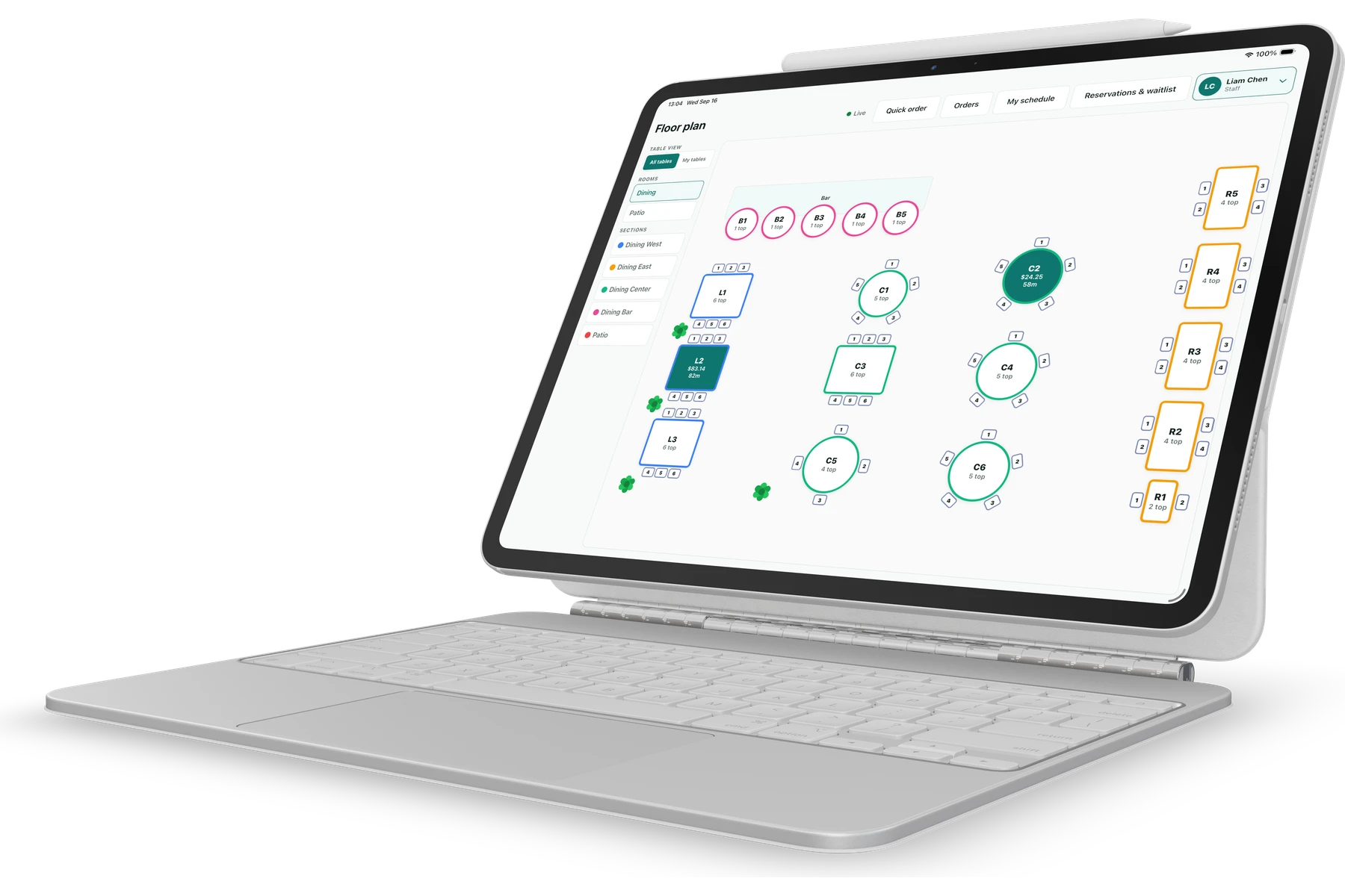 POS in light mode on a tablet with keyboard, showing the restaurant floor plan, table status, orders, and reservations